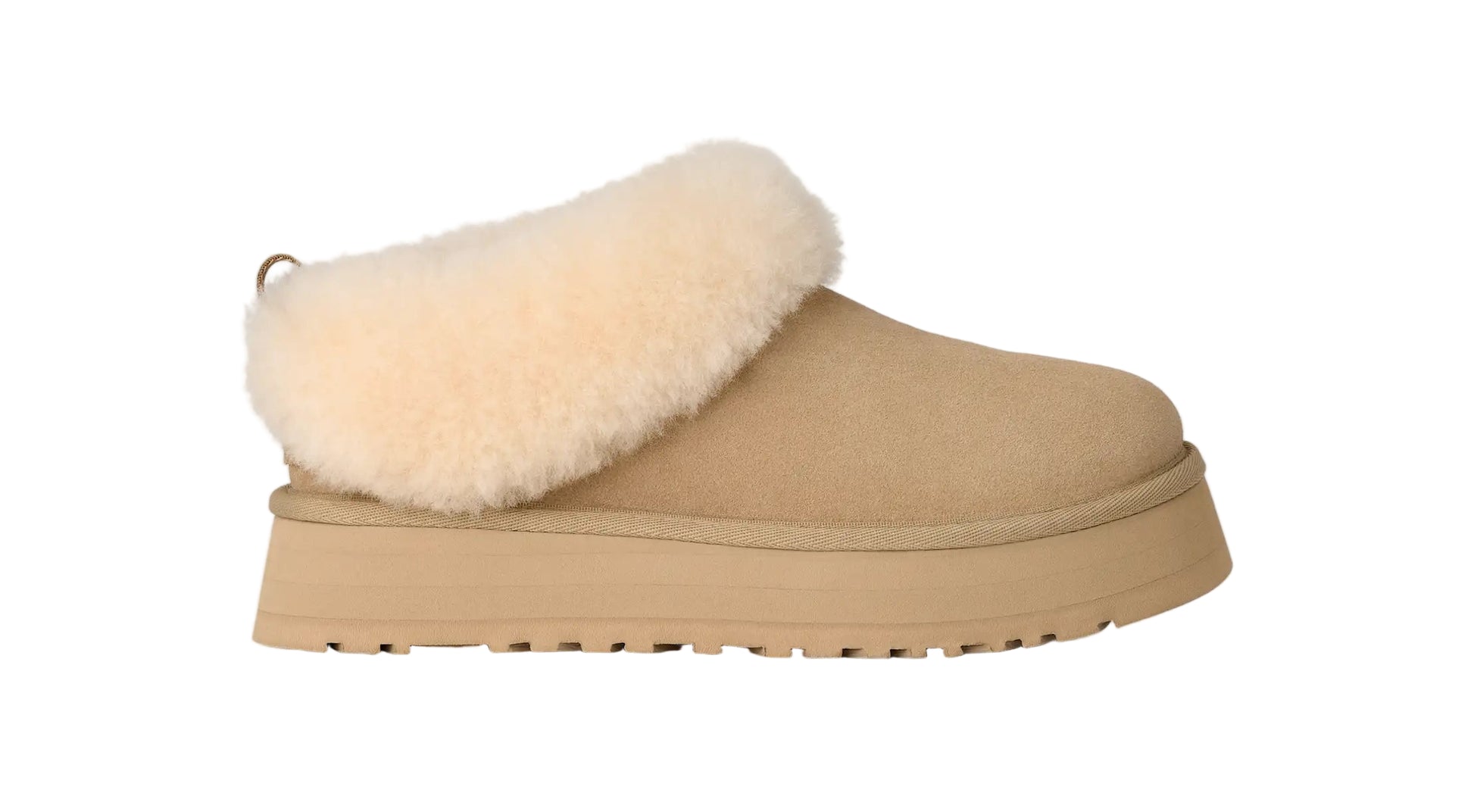 Beige slipper with white fur lining on a light gray background